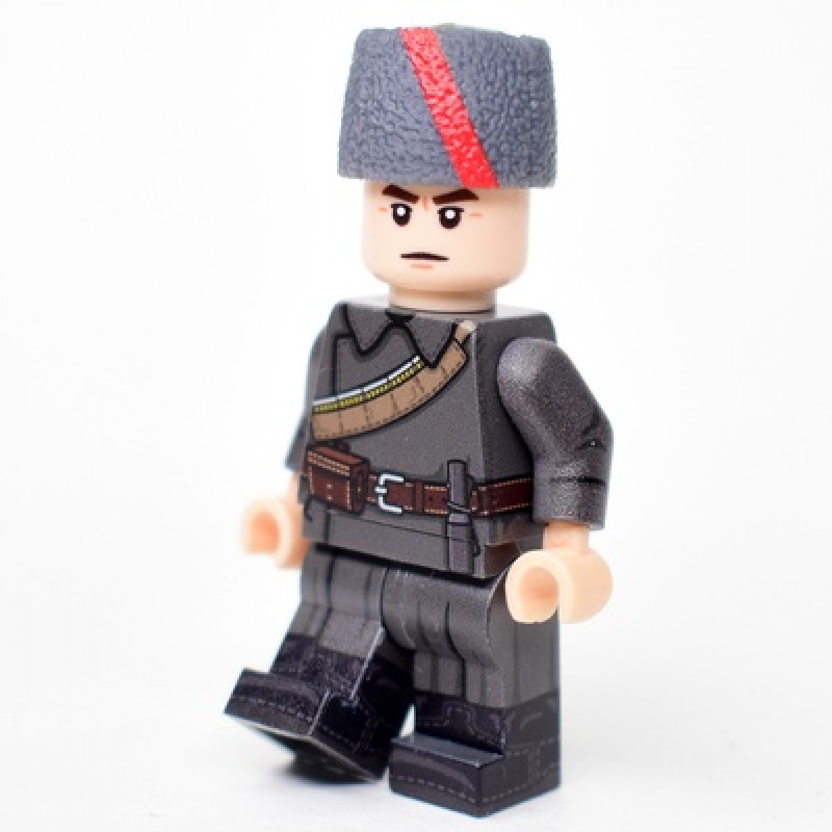 Red Army soldier in an overcoat and papakha with ribbon for the period of the Civil War