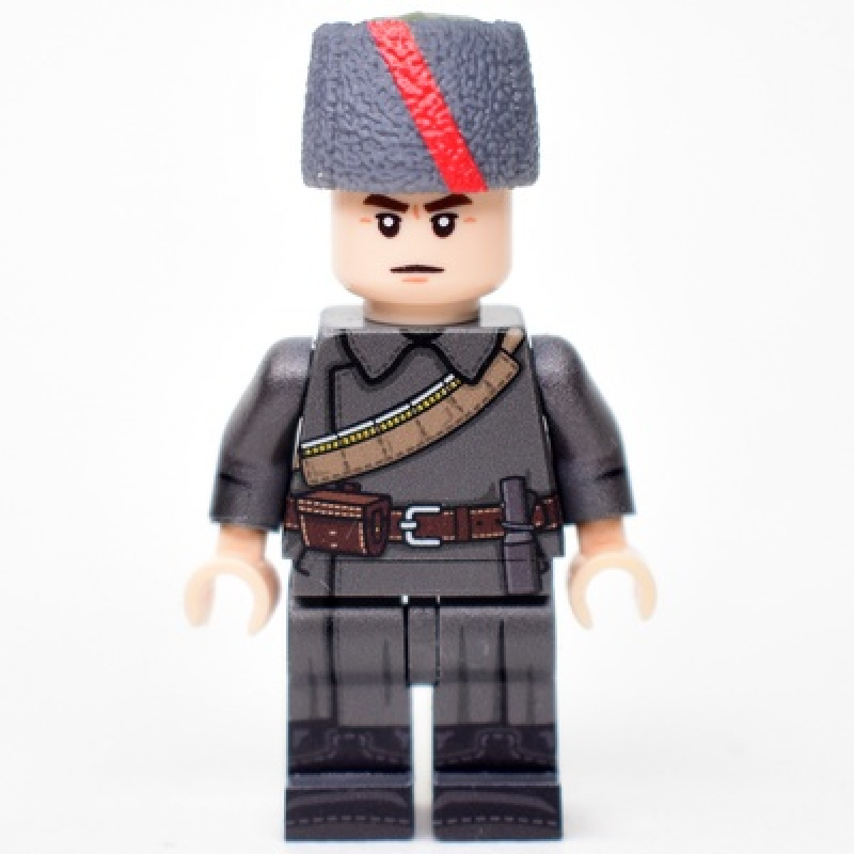 Red Army soldier in an overcoat and papakha with ribbon for the period of the Civil War