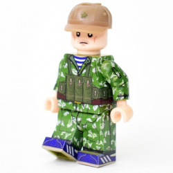 Airborne soldier in a KLMK camouflage coat, a birch tree, and a cap