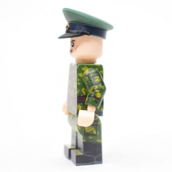 Borderguard in birch camouflage with a holster, wearing a cap