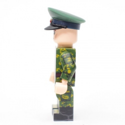 Borderguard in birch camouflage, wearing a cap